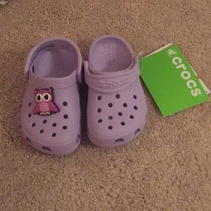 Brand new Crocs with charm!